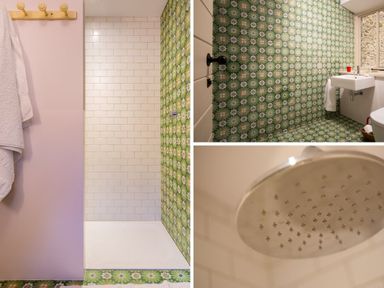 A bathroom with a shower area with white subway tiles and green floral tiles a sink and window in Kentmere Hall Bank Barn Kentmere