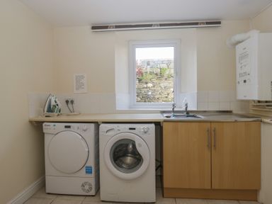 A laundry room with a washing machine and dryer at Woodside West in Bowness