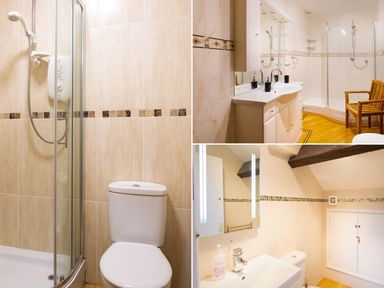 A bathroom with a shower cubicle and toilet a bathroom with a double sink and wooden chair and a bathroom with a sink, mirror and cabinet at Lakefield House in Hawkshead