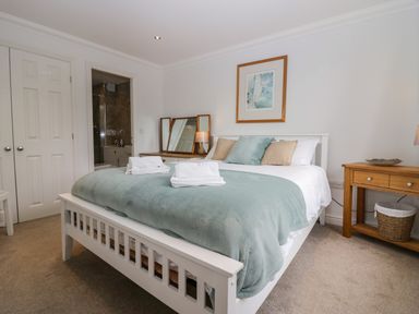 A bedroom with bed and side table at Middlerigg in Troutbeck