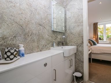 A bathroom with a sink and mirror at Middlerigg in Troutbeck