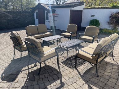 A seating area with chairs and tables at Bank Barn at Rusland in Grizedale