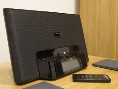 A black Sony audio docking station with a remote control on a wooden surface at Tall Trees in Bowness