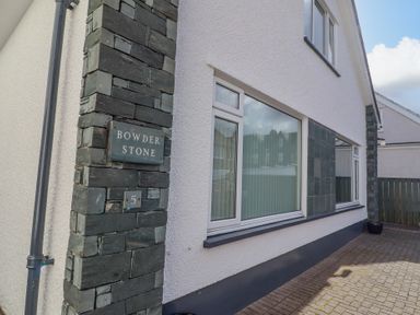 The exterior of a house with a stone pillar displaying the name Bowderstone and the number 5 at Bowderstone in Keswick