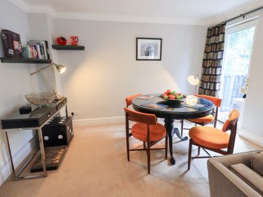 A dining room with a table and chairs at Ghyll Heights in Ambleside