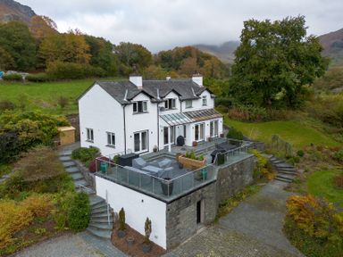 A house with a balcony and garden at Goody Raise in Grasmere