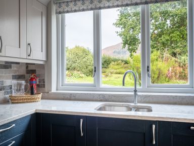 A kitchen with a sink and window at Goody Raise in Grasmere