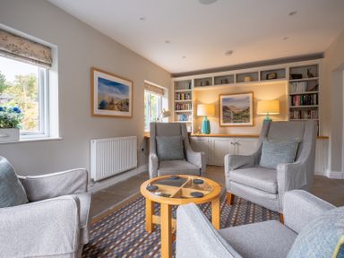 A snug with armchairs and coffee table at Goody Raise in Grasmere