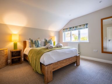 A bedroom with a bed and a lamp at Goody Raise in Grasmere