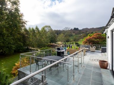An outdoor space with a table and chairs at Goody Raise in Grasmere
