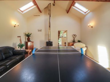 A recreation room with a ping pong table at Hawkshead Hall in Hawkshead