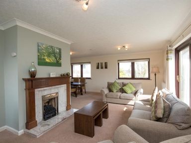 A living room with sofas and a fireplace at Todd Crag in Ambleside
