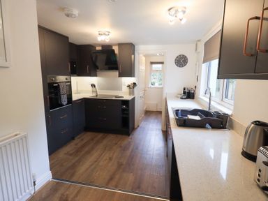 A kitchen with cabinets and appliances at Mardale in Ambleside