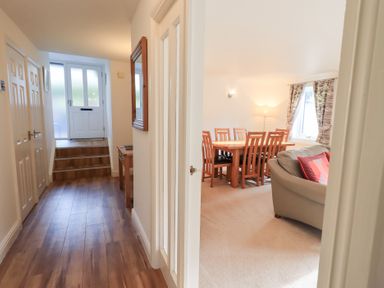 A hallway with a view of a dining area at Mardale in Ambleside