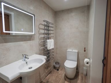 A bathroom with sink and toilet at Chapel Hill Cottage Ambleside