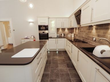 A kitchen with modern cabinets and appliances at South View in Keswick