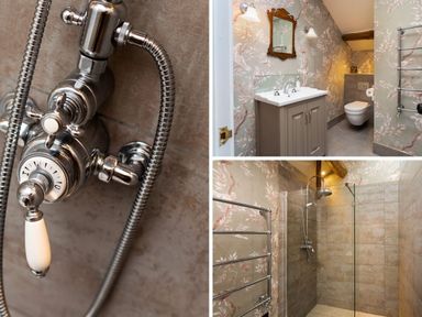 A bathroom with a sink cabinet and mirror a wall-mounted toilet and a walk-in shower at High Cunsey Farm in Far Sawrey