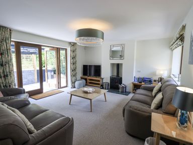 A living room with a coffee table and sofa at No 7 Ambleside