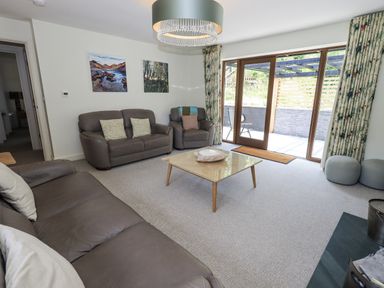 A living room with sofas and a coffee table at No 7 in Ambleside