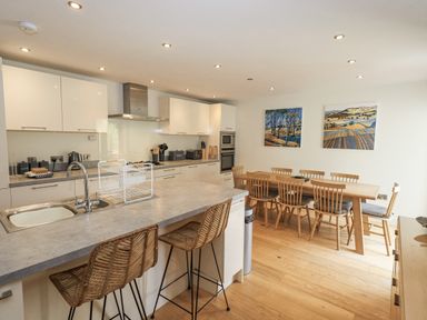 A kitchen with dining table and chairs at No 7 in Ambleside