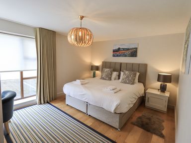 A bedroom with a double bed and nightstands at No 7 in Ambleside