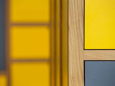 Close up of wooden furniture with yellow and gray panels at Gatesgarth in Coniston