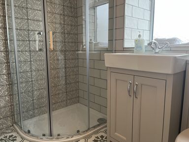 A bathroom with a shower and sink at The Stables At Cae Gwyn in Ruthin