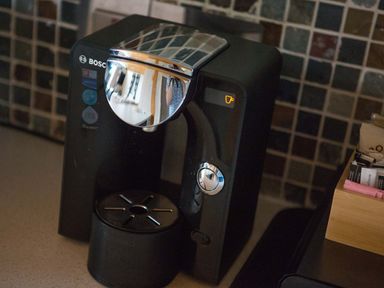 A Bosch coffee machine on a kitchen counter with tiled backsplash at Pine Tree in Otterburn