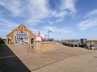 A harbour office building with a large buoy and dock area at Wells Harbour in Wells-Next-The-Sea