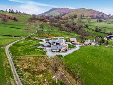 A house with garden and driveway at Bwthyn Y Bugail (Shepherd's Cottage) Pedairffordd near Llanrhaeadr-Ym-Mochnant