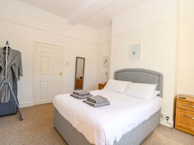 A bedroom with a bed and towels on it at Sunnymeade in Buxton, Norfolk