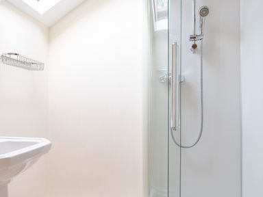 A bathroom with a shower and a sink at Bull Pen in Graythwaite near Hawkshead
