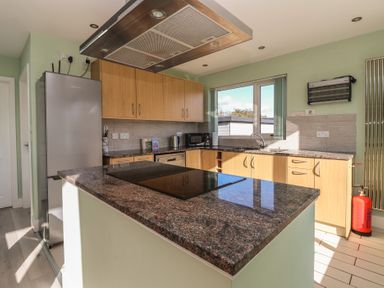 A kitchen with a countertop and appliances at Bluebell Wood in Brandesburton