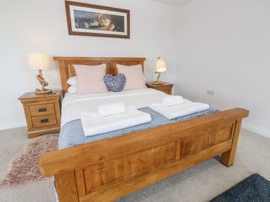 A bedroom with a double bed and bedside tables at Atlantic View in Germoe