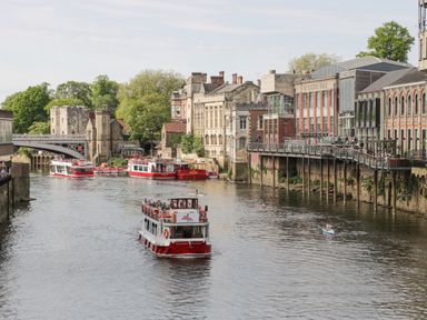 River with boats and buildings along the waterfront at 202 Salisbury Terrace in York