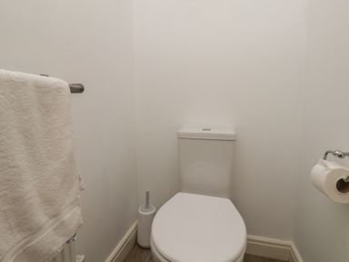 A bathroom with a toilet and towel rail at Buck Place The Bay - Filey