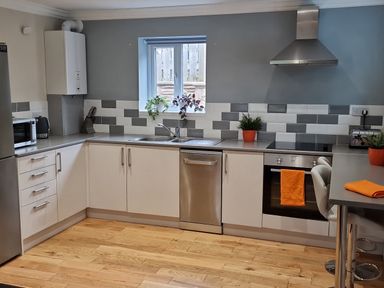 A kitchen with appliances and a sink at Bryn in Bethesda