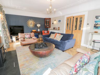 A living room with furniture including sofas and a coffee table at Pengwern in Llanrwst