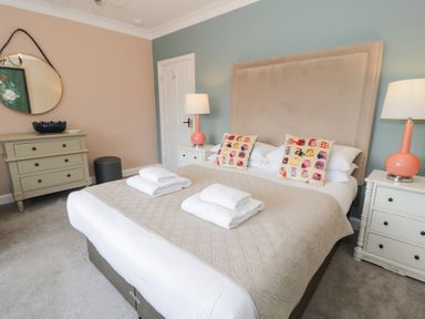 A bedroom with a bed and bedside tables at Pengwern in Llanrwst