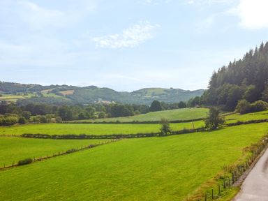 A view of fields and hills at Pengwern in Llanrwst
