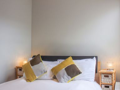 A bedroom with a bed and pillows at Simples in Dartmouth