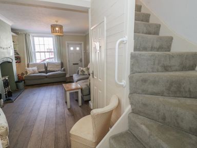 A living room with a sofa and coffee table at Heath Cottage Stratford-Upon-Avon