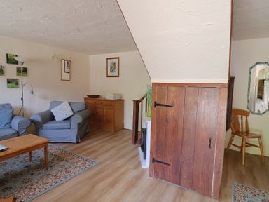 A living room with a sofa and coffee table at The Old Bakery in South Perrott near Mosterton