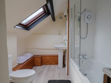 A bathroom with a shower and bath at The Old Bakery in South Perrott near Mosterton
