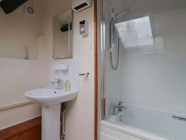 A bathroom with a sink and shower at The Old Bakery South Perrott near Mosterton