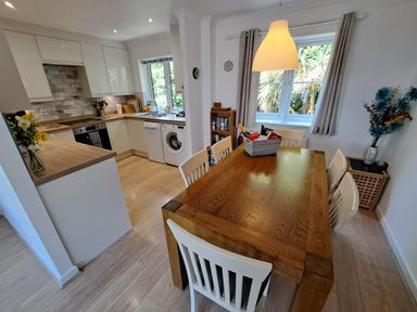A kitchen with dining area at Castle Cove View in Castle Cove