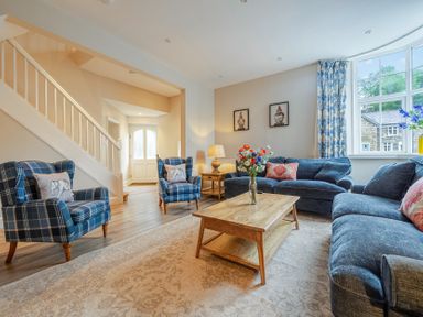 A living room with seating and a coffee table at Home Farmhouse at the Graythwaite Estate near Hawkshead