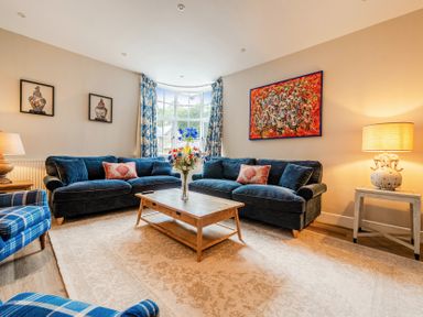 A living room with sofas and a coffee table at Home Farmhouse at the Graythwaite Estate near Hawkshead