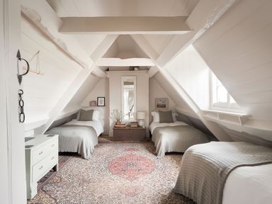 A bedroom with three beds and a mirror at Reybridge House in Lacock