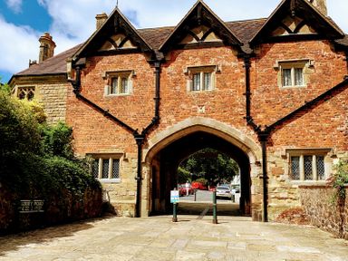 A brick building with archway at The Escape in Malvern
